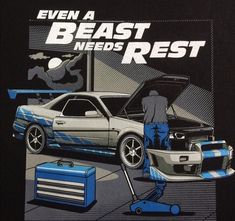 the back of a black shirt with an image of a car and mechanic's tools