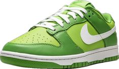 the nike dunk low is bright green and white with a contrasting color scheme on the upper