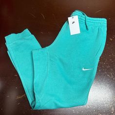 Nike Mens Mint Green Sportswear Standard Fit Tapered Leg Sweatpants Size Large Brand: Nike Department: Men Size: L Color: Green Type: Pants Style: Sweatpants Pattern: Solid Theme: Sports Occasion: Activewear Season: All Season Features: Elastic Waist, Comfort, Pockets Condition: New With Tags I Offer Discounts For All Return Customers. - Jvs Nike Green Joggers With Pockets, Green Nike Joggers With Pockets, Nike Cotton Pants With Moisture-wicking, Blue Sportswear Bottoms With Ribbed Waistband, Casual Blue Tracksuit For Gym, Casual Blue Tracksuit For The Gym, Nike Cotton Gym Pants, Nike Cotton Sweatpants For Gym, Green Casual Tracksuit For Gym