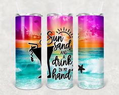 three colorful tumbles with the words sun sand and drink in my hand on them