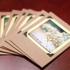 a bunch of cards sitting on top of a wooden table