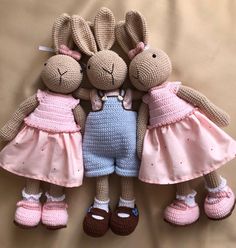 two stuffed animals are laying next to each other on a bed with pink slippers