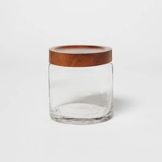 a glass jar with a wooden lid