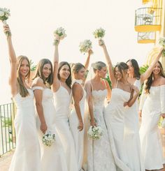 a group of women in white dresses holding bouquets