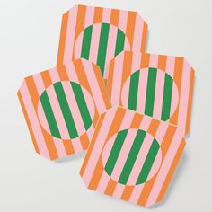 four orange and green striped paper plates