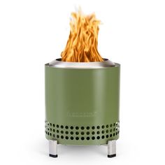 a green portable stove with flames coming out of it