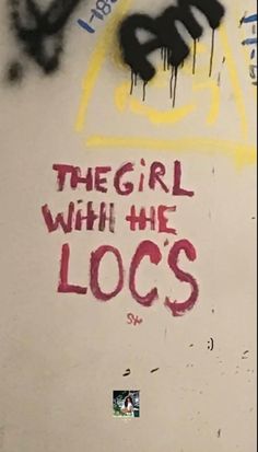 graffiti written on the side of a wall that says, they girl with the locs