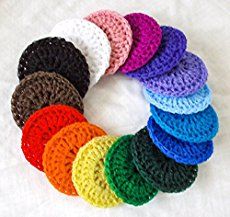 a bunch of crocheted coasters sitting on top of a white surface