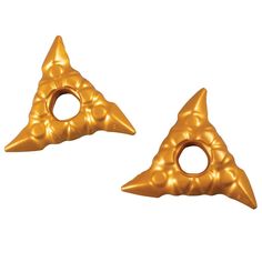 two pieces of gold colored metal with holes in the shape of pyramids, on a white background