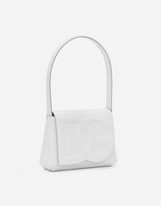 Find DOLCE & GABBANA Calfskin Logo Shoulder Bag on Editorialist. This Dolce & Gabbana calfskin shoulder bag features a flap fastening with concealed double magnetic fastening. It has a flat back pocket, a calfskin shoulder strap, and an Alcantara lining with a zipped pocket. The bag includes a branded dust bag and measures 17.5 x 23 x 7 centimeters. It is made in Italy. White Calf Leather Shoulder Bag With Removable Pouch, Designer White Calf Leather Shoulder Bag, White Calf Leather Shoulder Bag With Soft Leather, Designer White Calf Leather Bag, White Rectangular Calf Leather Shoulder Bag, Luxury White Calf Leather Shoulder Bag, Luxury White Calf Leather Bag, Floral Pumps, Micro Bags