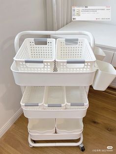 two white baskets are stacked on top of each other