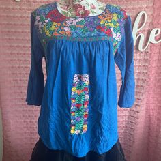 Never Worn. Nwot. Super Cute Classic Embroidered ‘70s Style Peasant Top. Great For Spring And Summer Wear! Brand: J.Marie Style: Peasant/Bell Sleeve Color: Blue With Floral Embroidery Size: S Cotton Fully Lined Flared/Bell Sleeves Measurements: L - 24” B- Up To 42” Bundle To Save! 15% Off When You Buy 2 Items Or More In My Closet. Vintage Blue Embroidered Blouse, Spring Blue Geometric Embroidered Blouse, Blue Folk Top With Geometric Embroidery, Blue Blouse With Geometric Embroidery For Spring, Vintage Blue Embroidered Top, Spring Hippie Embroidered Peasant Top, Spring Hippie Peasant Top With Floral Embroidery, Embroidered Hippie Peasant Top, Spring Blue Embroidered Top With Floral Details