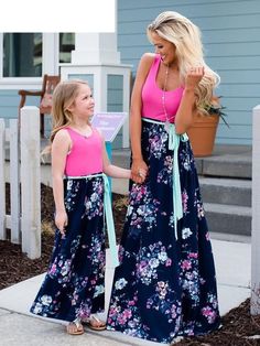 Every momma and her little girl need this fabulous maxi dress with a tank top and floral skirt. Casual chic for the Mommy & Daughter date. Made with a polyester blend and comes in 4 fun patterns from which to choose. Save 20% if buying a 2 or More daughter dresses using code: Momma&Me at checkout Daughter Dress, Mother Daughter Dresses Matching, Mother Daughter Outfits, Mother Daughter Dress, Matching Costumes, Mommy And Me Dresses, Mommy Daughter, Elegant Maxi Dress, Floral Dresses Long