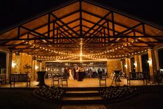 an outdoor wedding venue lit up at night