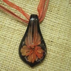 Handmade Murano Glass Petal Necklace. Clear Front, Black Back. Red Flower Inside With Metallic Copper In Background. Red Cord And Sheer Ribbon Necklace That Has A Lobster Clasp Closure. 18 Inches Long With Adjustable Chain Tail. Petal Is 2 1/8 Inches High, 1 Inch Wide. New Item From My Local Shop. Great For Anyone Who Likes Floral Themes Or Art Glass. Adjustable Black Flower Pendant Necklace, Red Adjustable Flower Necklace, Black Adjustable Flower Pendant Necklace, Black Flower Necklace For Party, Elegant Black Flower Pendant Necklace, Handmade Black Flower Necklace, Adjustable Red Flower Necklace, Black Flower Necklace For Gift, Elegant Black Necklace With Flower Charm