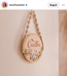 a wall hanging decoration with the word cecilia on it