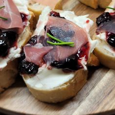 several pieces of bread with meat and cheese on them