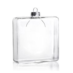 an empty square glass container with a metal hook