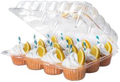 cupcakes with lemon slices and white frosting in a plastic container on a white background