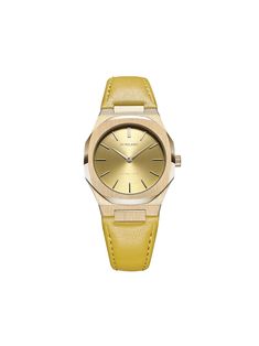 Gold-tone calf leather Citron 34mm from D1 MILANO featuring index dial, stainless steel case, leather strap, round face, buckle fastening, quartz movement and adjustable fit. This item comes with a standard two-year warranty from the brand.. Yellow Gold Leather Watch With Metal Dial, Modern Gold Leather Watch Accessories, Modern Gold Watch With Leather Strap, Luxury Yellow Gold Watch Accessories For Everyday, Yellow Gold Watches With Metal Dial And Leather Strap, Yellow Gold Watches With Metal Dial And Leather Band, Luxury Everyday Yellow Gold Watch Accessories, Yellow Gold Leather Watch With Round Dial, Timeless Yellow Gold Leather Watch