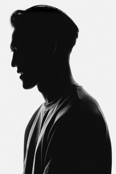 a black and white photo of a man in profile