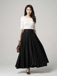 "This black pleated maxi skirt is the perfect combination of comfort and style. The elegant and flowy design is made with high-quality materials that drape beautifully on any figure. The versatile style and classic color make it easy to dress up or down, so you can wear it for any occasion. The pleated design adds a touch of femininity and movement to your look, making it perfect for choosing. DETAIL * 100% polyester * Pleated skirt * Ankle Length * Two pockets * Belt loops on waistband * Side z Full-length Pleated Black Skirt, Full Length Black Pleated Skirt, Black Full-length Flowing Pleated Skirt, Black Full Length Flowy Pleated Skirt, Black Pleated Full-length Skirt, Full Length Black Flowy Pleated Skirt, Full Length Flowy Black Pleated Skirt, Long Skirt With Pleated Waist In Solid Color, Solid Color Long Skirt With Pleated Waist