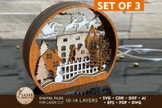 a wooden cut out of a house with trees and sleighs on it