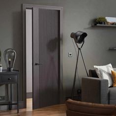 a living room with grey walls and wooden floors