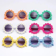 Adorable Daisy Flower Sunglasses for Your Little Sunshine Brighten up your child's day with our Kids Round Daisy Flower Sunglasses! Designed for outdoor sun protection, these charming and whimsical shades add a dash of retro flair to any outfit. The round frames, decorated with cute daisy petals, come in six cheerful colors, perfect for any little girl's sunny adventures. Whether it's a family outing, beach day, or festival party, these sunglasses will help your child step out in style while keeping their delicate eyes safe from harmful UV rays. Outstanding Features of Kids Daisy Sunglasses Retro Fashion: Cute round daisy flower frames capture the playful spirit of the past while adding a modern, fun twist. Six Vibrant Colors: Choose from a range of colorful frames to match your child's pe Playful Flower-shaped Plastic Sunglasses, Cute Flower Shaped Sunglasses With Uv Protection, Playful Multicolor Sunglasses For Spring, Fun Multicolor Sunglasses For Spring, Fun Multicolor Spring Sunglasses, Cute Adjustable Sunglasses With Uv Protection, Cute Sunglasses With Uv Protection, Cute Sunglasses With Uv Protection For Spring, Cute Spring Sunglasses With Uv Protection