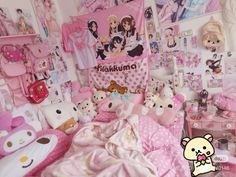 a room filled with lots of pink and white stuff animals on top of bed sheets