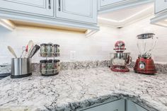 the kitchen counter is clean and ready to be used as a blender or mixer