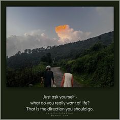 two people walking down a dirt road with a sky in the background that says, just ask yourself - what do you really want about life?