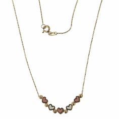 Elevate her style with our 18K Solid Yellow Gold Enamel Pink and White Mini Hearts Necklace, featuring five tridimensional enamel mini hearts. Designed for ages 12 and up, it comes with a 16-inch chain and an extra ring at 15 inches, all crafted from hypoallergenic 18k gold. Complete with an Amalia gift box and bag, providing an elegant presentation, and it pairs beautifully with the matching bracelet (SKU FAT2000HB), ensuring a coordinated and sophisticated look. Make a statement with this exqu