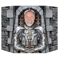 an image of a man dressed as a knight in front of a stone wall and gate