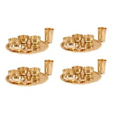 set of four gold plated candle holders