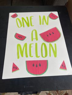 one in a melon is cut into pieces and placed on top of a piece of paper