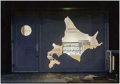 an open garage door with the reflection of a map on it