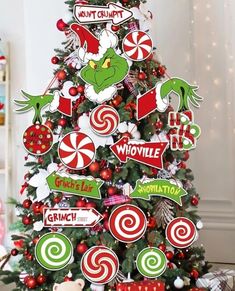 a christmas tree decorated with candy canes and grin the cat sticker decals