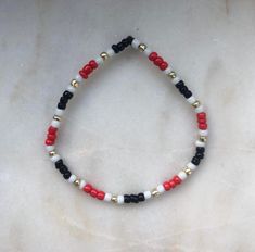 Small beads bracelet similar to Egypt flag. See last pic to choose size. I may have to use a different number of beads per color for medium and large. The colors may not be completely accurate. Contact me for questions! Red Bracelets With Letter Beads, Red Bracelets With Black Round Beads, Red Stretch Bracelet With Black Beads, Red Stretch Bracelet With Black Beads As A Gift, Small Beads Bracelet, Egyptian Bracelet, Egypt Flag, Small Bead Bracelet, Colored Jewelry