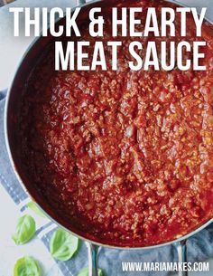 thick and hearty meat sauce in a pan with the words, thick & hearty meat sauce