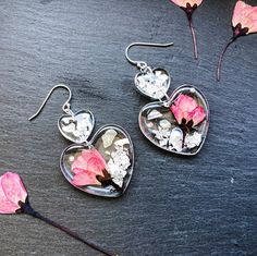 Cherry Blossom Double Hearts Handmade Clear Earrings These impressive earrings perfectly add a pretty finishing touch to any outfit and they are sure to make you look good and feel good. The earrings are delicately handmade one by one, real pressed flowers preserved in clear resin. You can choose to write your name (max. 5 English characters) at the back of the earrings, please specify in the personalization box. If you purchase with gifting purpose, we also have a tailor-made Dried Flower Gift Handmade Flower Earrings For Valentine's Day, Silver Flower Earrings For Valentine's Day, Pressed Flower Resin, English Characters, Hearts Earrings, Pressed Flower Crafts, Clear Earrings, Flower Resin, Polish Silver