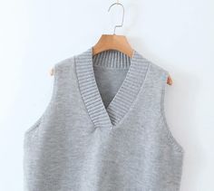 Vest type: knitted vest vest style: Casual Style: Hedging Length: Medium length (65cm＜length≤80cm) pattern: plain Popular elements: stitching Fabric name: Knitting Main fabric composition: polyester fiber (polyester) The content of the main fabric ingredient: 71%-80% color: grey Winter Knit Sleeveless Sweater Vest, Knit Sleeveless Sweater Vest For Winter, Winter Sleeveless Knit Sweater Vest, Knitted Sleeveless Vest For Fall, Sleeveless Knitted Vest For Fall, Sleeveless Sweater Vest For Winter Layering, Stretch Knit V-neck Vest, Stretch Sleeveless Sweater Vest For Winter, Gray Fitted V-neck Sweater Vest