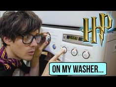 a young man is looking at an old washing machine with the words h p on it