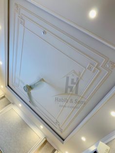 an overhead view of the ceiling in a house with white walls and lights on it