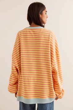 So cool and classic, this timeless crewneck is featured in an oversized, slouchy silhouette and staple striped print with contrasting hems for added dimension. **Fit:** Relaxed, oversized fit **Features:** Crew neckline, dropped shoulders, contrast hems **Why We | Classic Striped Oversized Crewneck by We The Free at Free People in Orange, Size: L Relaxed Fit Crew Neck Top With Striped Cuffs, Oversized Tops With Striped Collar For Fall, Oversized Contrast Stripes Tops For Loungewear, Oversized Tops With Contrast Stripes For Layering, Oversized Striped Top For Layering, Oversized Striped Tops For Loungewear, Oversized Retro Sweatshirt, Striped Oversized Crew Neck Top, Oversized Striped Crew Neck Top