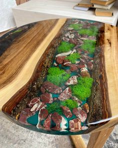 a table that has some rocks and grass on it