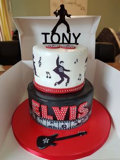 a three tiered cake decorated with musical notes and the words'tony'on it