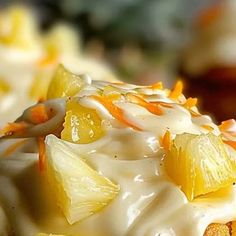 a close up view of some food with oranges and cream on it's side