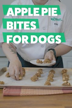 a woman in white shirt holding a plate with food on it and text overlay that reads apple pie bites for dogs