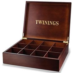 an open wooden box with twelve compartments and the word twins in gold lettering on it